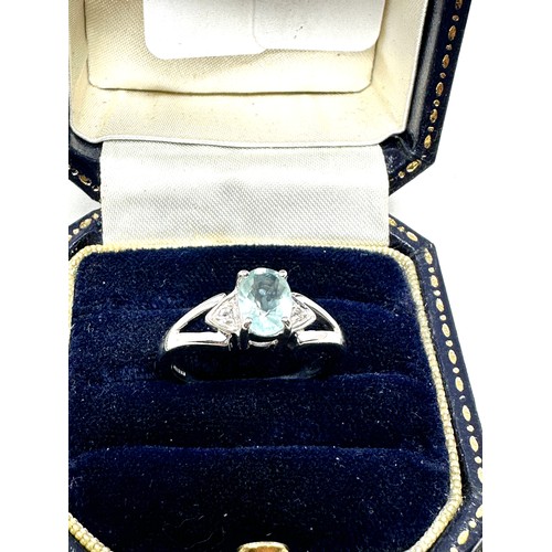 103 - 9ct white gold diamond and green gemstone  ring (3.1g)