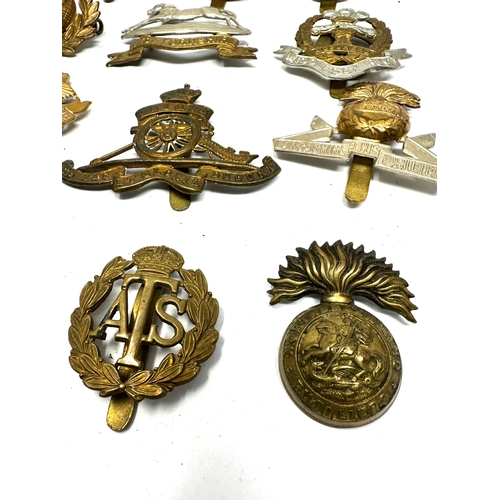 35 - 12 military cap badges inc lancashire fusiliers -essex reg .york etc