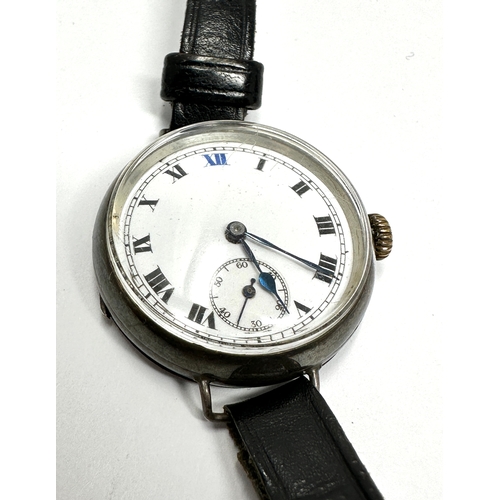 479 - silver cased gents Vintage trench style wrist watch hand winding the watch is ticking measures appro... 