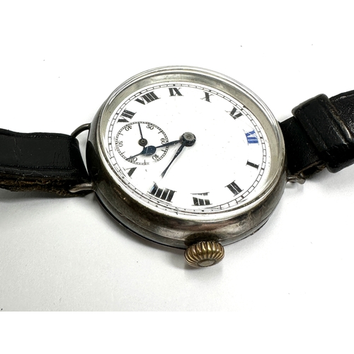 479 - silver cased gents Vintage trench style wrist watch hand winding the watch is ticking measures appro... 