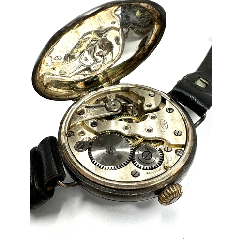 479 - silver cased gents Vintage trench style wrist watch hand winding the watch is ticking measures appro... 