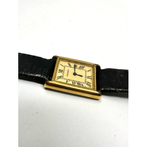 477 - Vintage gents Movado gold tone tank wrist watch hand winding the watch is ticking black leather stra... 