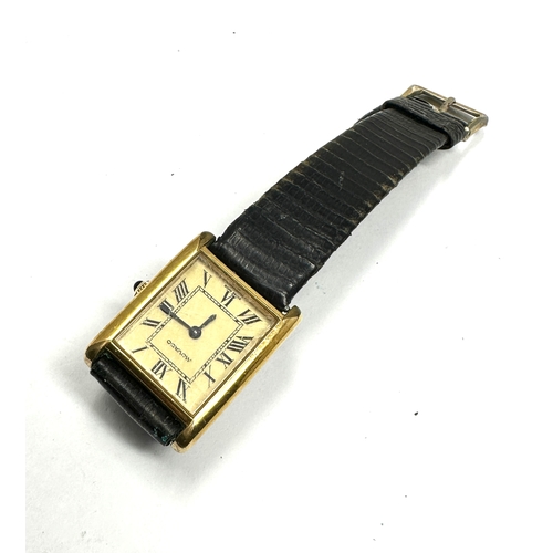 477 - Vintage gents Movado gold tone tank wrist watch hand winding the watch is ticking black leather stra... 