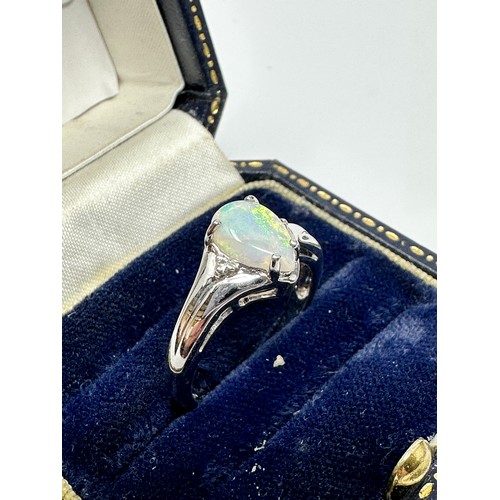 261 - 9ct White Gold Diamond And Opal  Ring (3.1g)