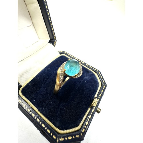 183 - 9ct Gold Blue Topaz  Ring With Diamond Accents (2.7g)