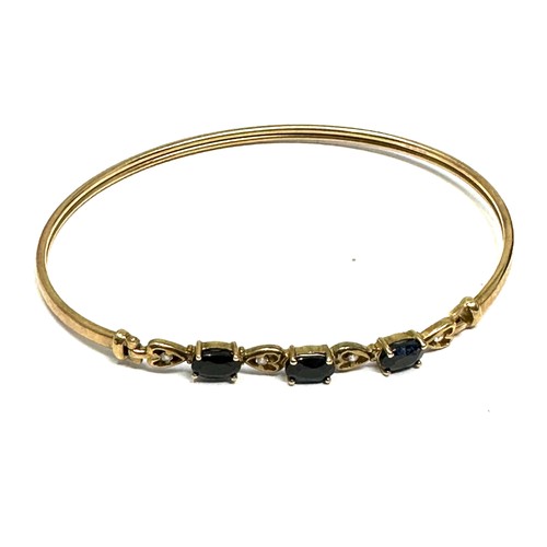 248 - 9ct Gold Diamond And Sapphire Heart Details  Bangle Bracelet (4.4g)