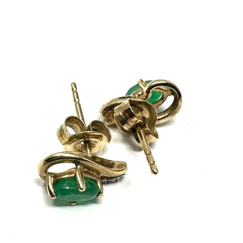 276 - 9ct  Gold Diamond And Emerald Earrings (1.1g)