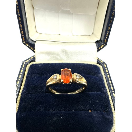 372 - 9ct Gold Diamond & Orange Gemstone Three Stone Ring (1.8g)