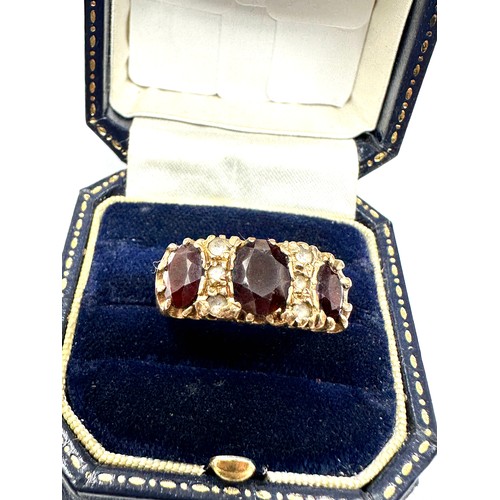 182 - 9ct Gold Garnet Three Stone Ring With White Gemstone (4.7g)