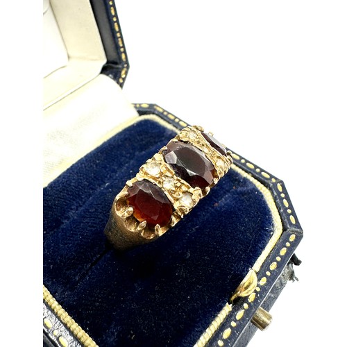 182 - 9ct Gold Garnet Three Stone Ring With White Gemstone (4.7g)