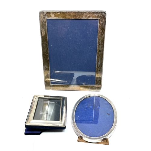 84 - 3 silver picture frames largest measures approx 22cm by 16cm