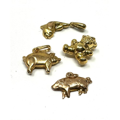 293 - 4 x 9ct gold animal pendants inc. bear, pig & fish (3.3g)