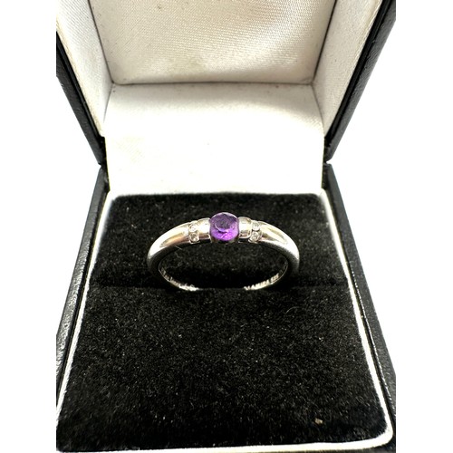 292 - 14ct white gold diamond and amethyst ring (2.3g)