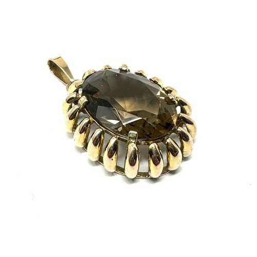 131 - 9ct gold smoky quartz pendant (8.3g)