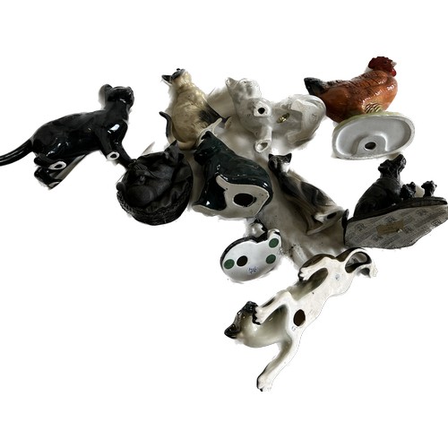 61 - Selection of pottery animal ornaments to include cats, chicken etc