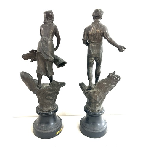 297 - Pair of metal figures on base, L