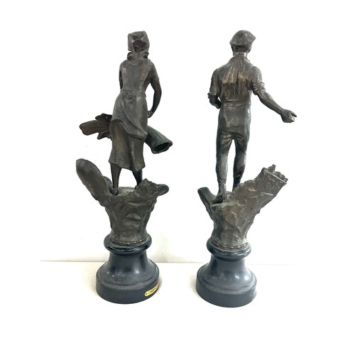 297 - Pair of metal figures on base, L