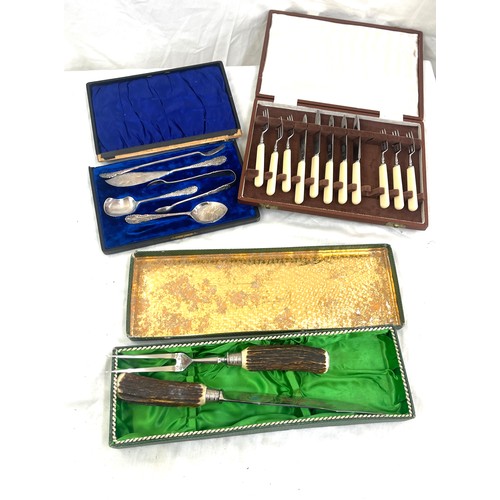 104 - Selection of boxed cutlery includes carving set etc