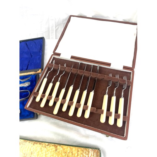 104 - Selection of boxed cutlery includes carving set etc