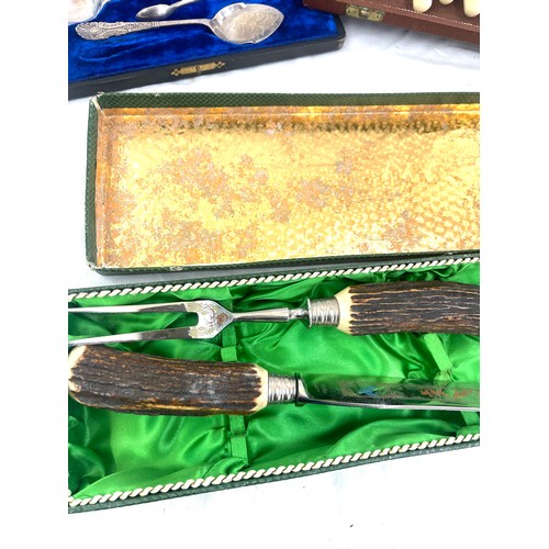 104 - Selection of boxed cutlery includes carving set etc