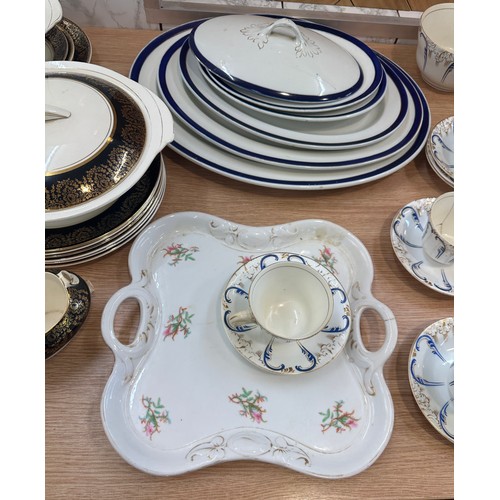 289 - Large selection of part tea and dinner services one hand painted to include meat trays, cups, saucer... 