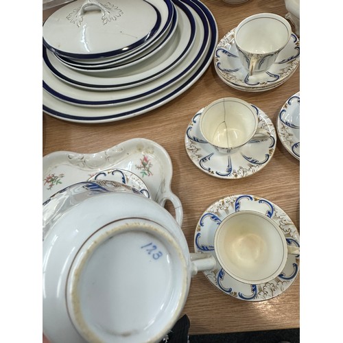 289 - Large selection of part tea and dinner services one hand painted to include meat trays, cups, saucer... 