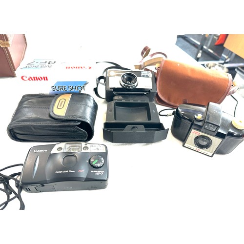 95 - Selection of vintage cameras to include a Kodak brownie 127 camera, vintage Kodak 155x Instamatic ca... 