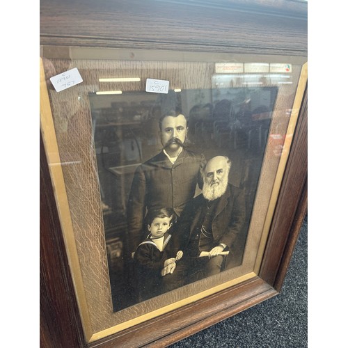 175 - Large vintage wooden framed family portrait measures approx 28 inches wide by 33 inches tall