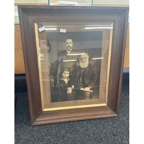 175 - Large vintage wooden framed family portrait measures approx 28 inches wide by 33 inches tall