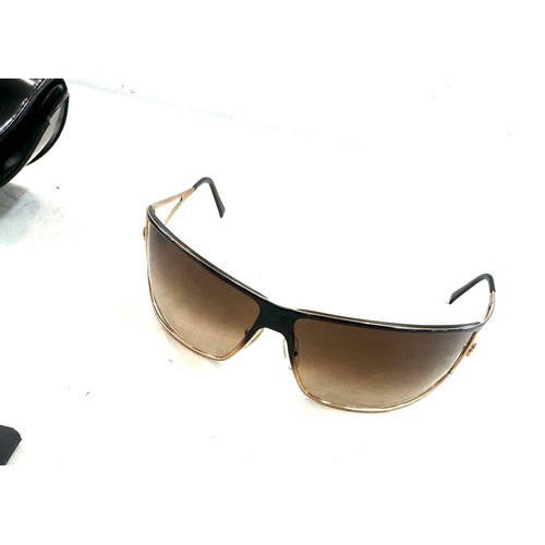 552 - GenuinE pair of vintage Versace sunglasses in case with COA