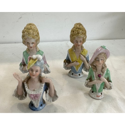 413 - Four vintage porcelain lady pin cushion tops all signed