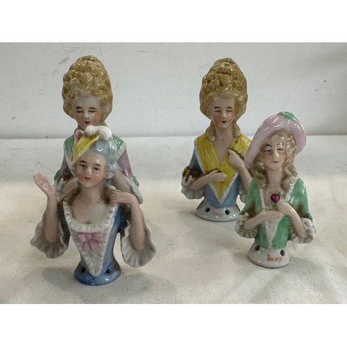 413 - Four vintage porcelain lady pin cushion tops all signed