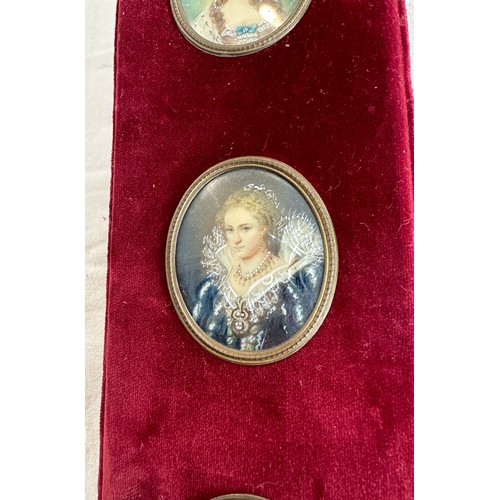 120 - Three reproduction copies of hand painted miniatures on a sash