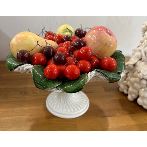 294 - Two large porcelain table centre pieces of fruit- tallest measures approx 18 inches tall