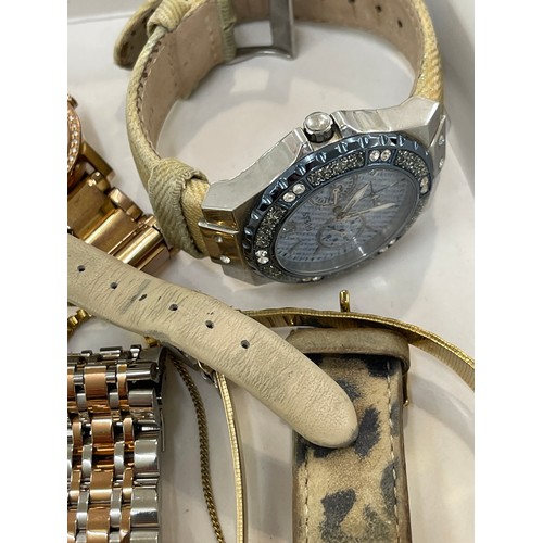 512 - Large selection of ladies wrist watches includes Comtex, Lige, Guess etc