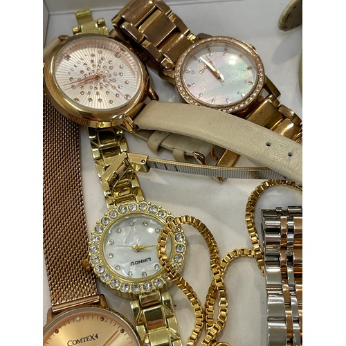 512 - Large selection of ladies wrist watches includes Comtex, Lige, Guess etc