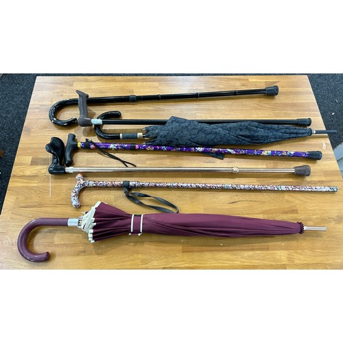 313 - Selection of ladies walking sticks and umbrellas with stand