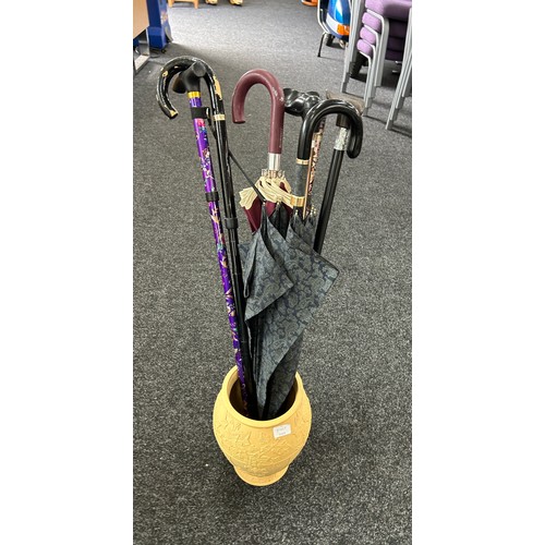 313 - Selection of ladies walking sticks and umbrellas with stand