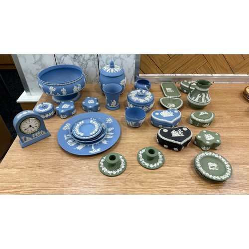 251 - Selection of Wedgwood to include clock, candle sticks, plates etc