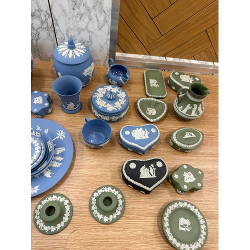 251 - Selection of Wedgwood to include clock, candle sticks, plates etc