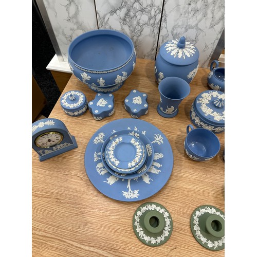 251 - Selection of Wedgwood to include clock, candle sticks, plates etc