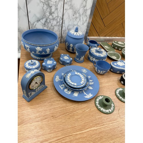 251 - Selection of Wedgwood to include clock, candle sticks, plates etc