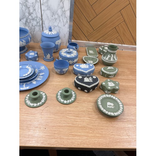 251 - Selection of Wedgwood to include clock, candle sticks, plates etc