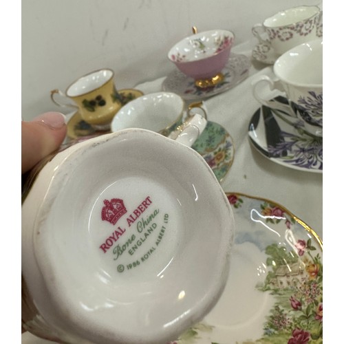 164 - Selection of single cup and saucers to include Royal Albert,  Crownford etc