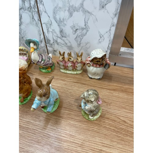 285 - Selection of 12 Beswick Beatrix potter figures includes Miss Moppet, Peter rabbit, Squirrel Nutkin, ... 