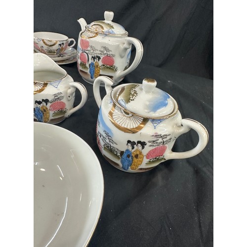 117 - Oriental hand painted tea service with marks to base to include 11 cups complete cups and saucers, t... 