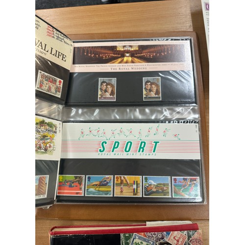 129 - Selection of assorted vintage and later stamps from various different countries in stamps albums and... 