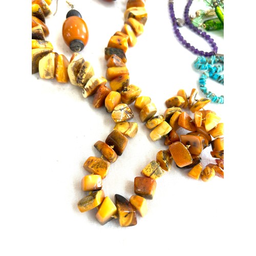 488 - Selection of assorted beads includes amber, turquoise etc