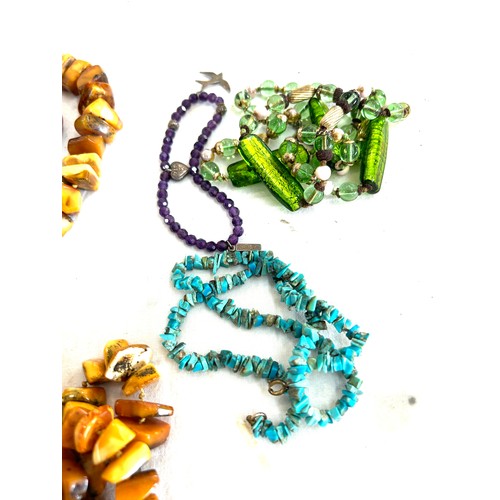 488 - Selection of assorted beads includes amber, turquoise etc