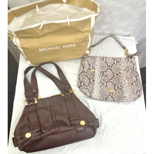 189 - Two authentic Micheal Kors Brown ladies hand bags